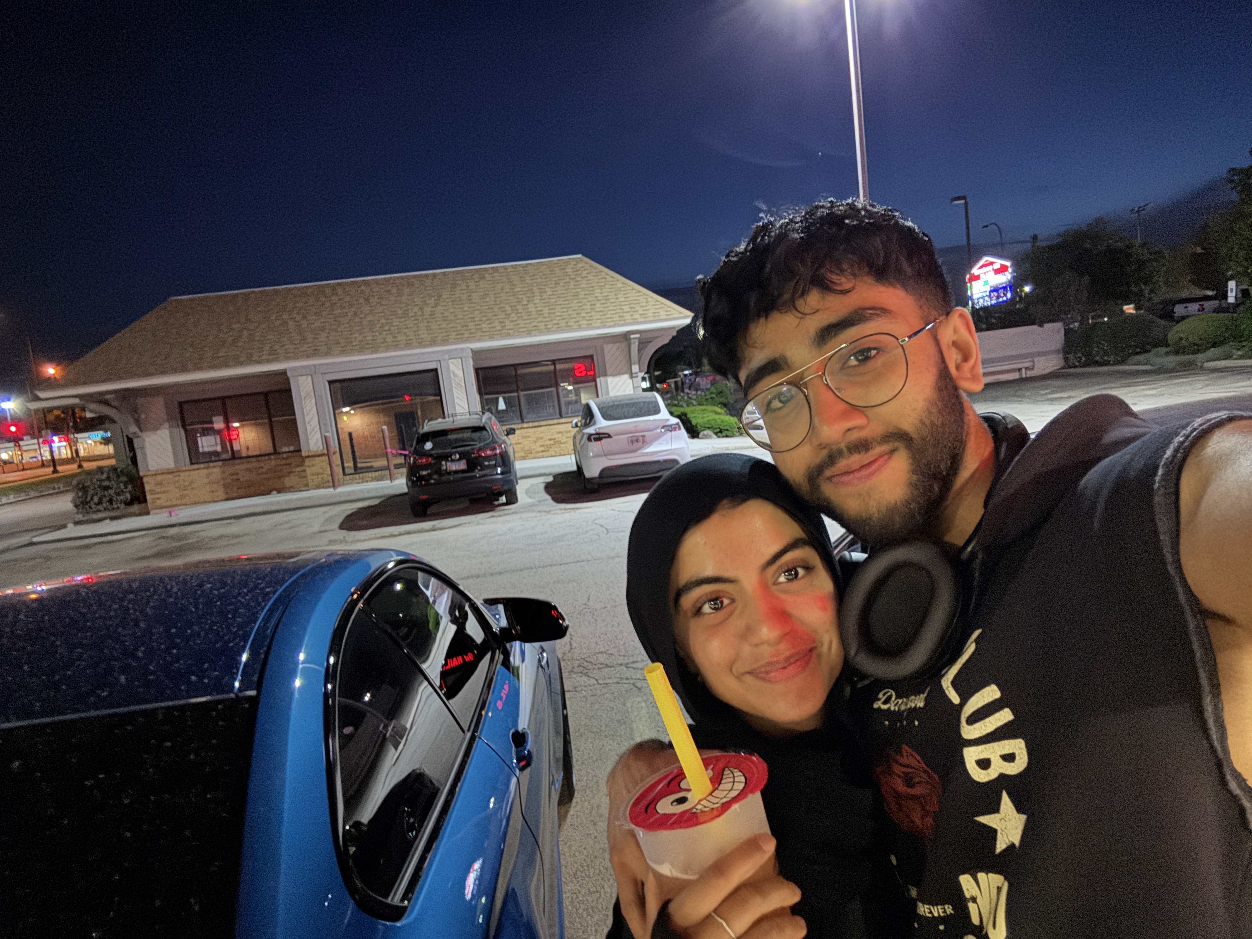 Night smoothie selfie by blue car