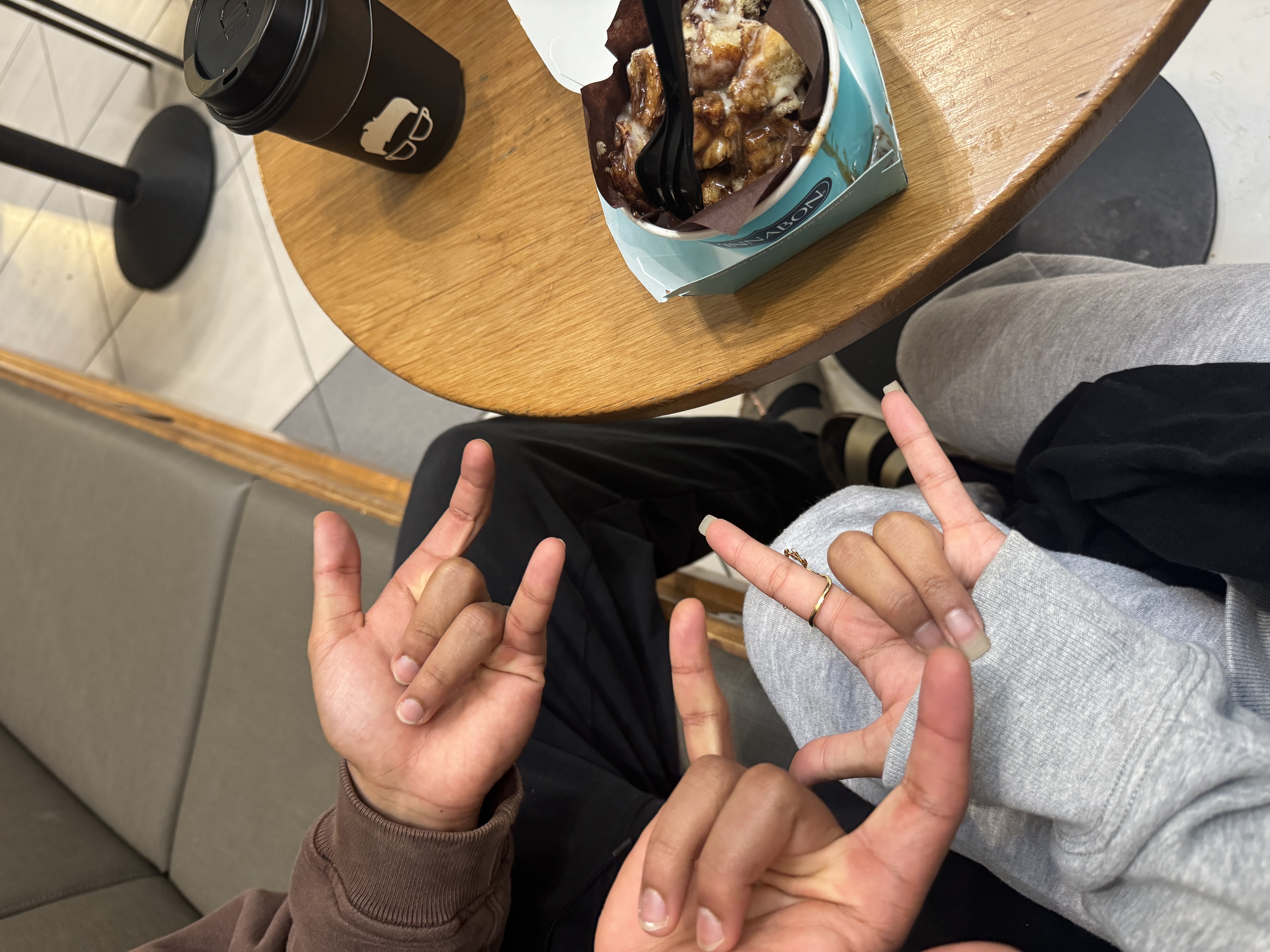Cinnabon date with ILY signs